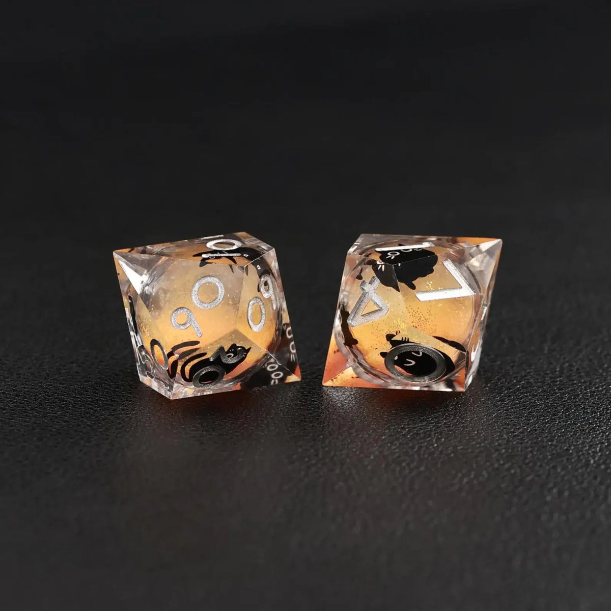The mesmerizing swirling liquid core effect in the Orange Swirl Resin Set dice, with a cat animal dice accent.