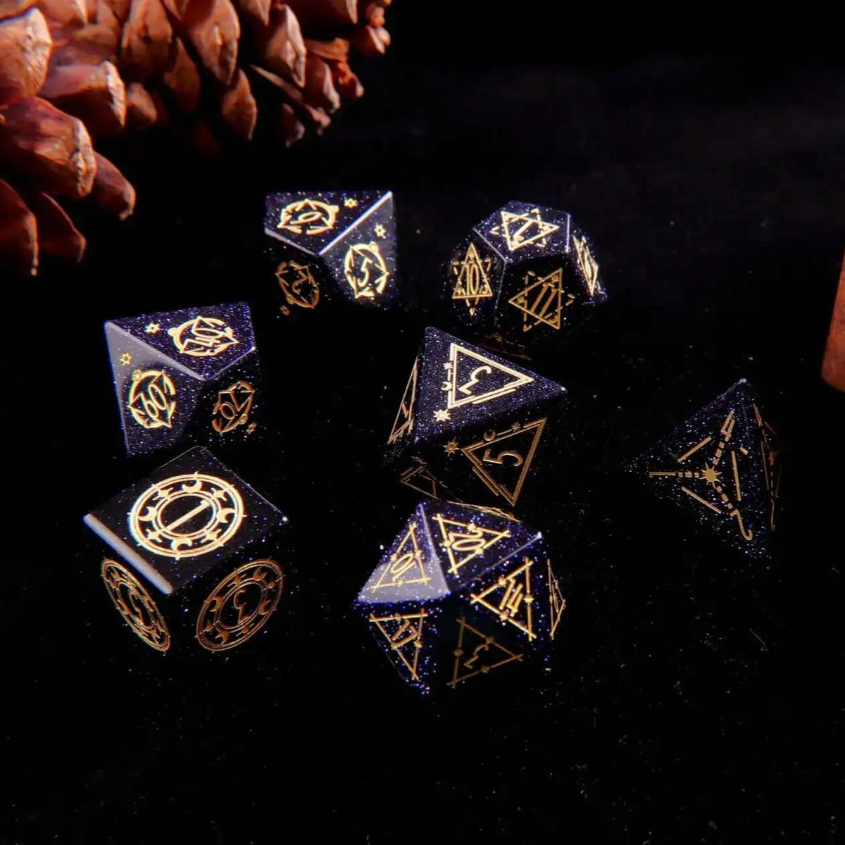 A set of 7 D&D Blue Sandstone Gem-carved Dice on a black background