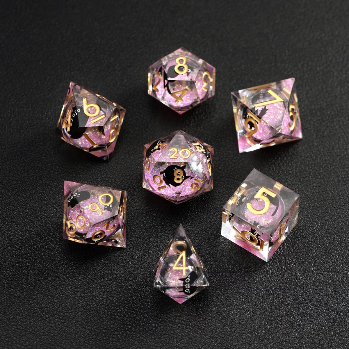 Close-up of Pink Swirl Liquid Core Dice Resin Set, featuring the black cat animal dice inclusion.