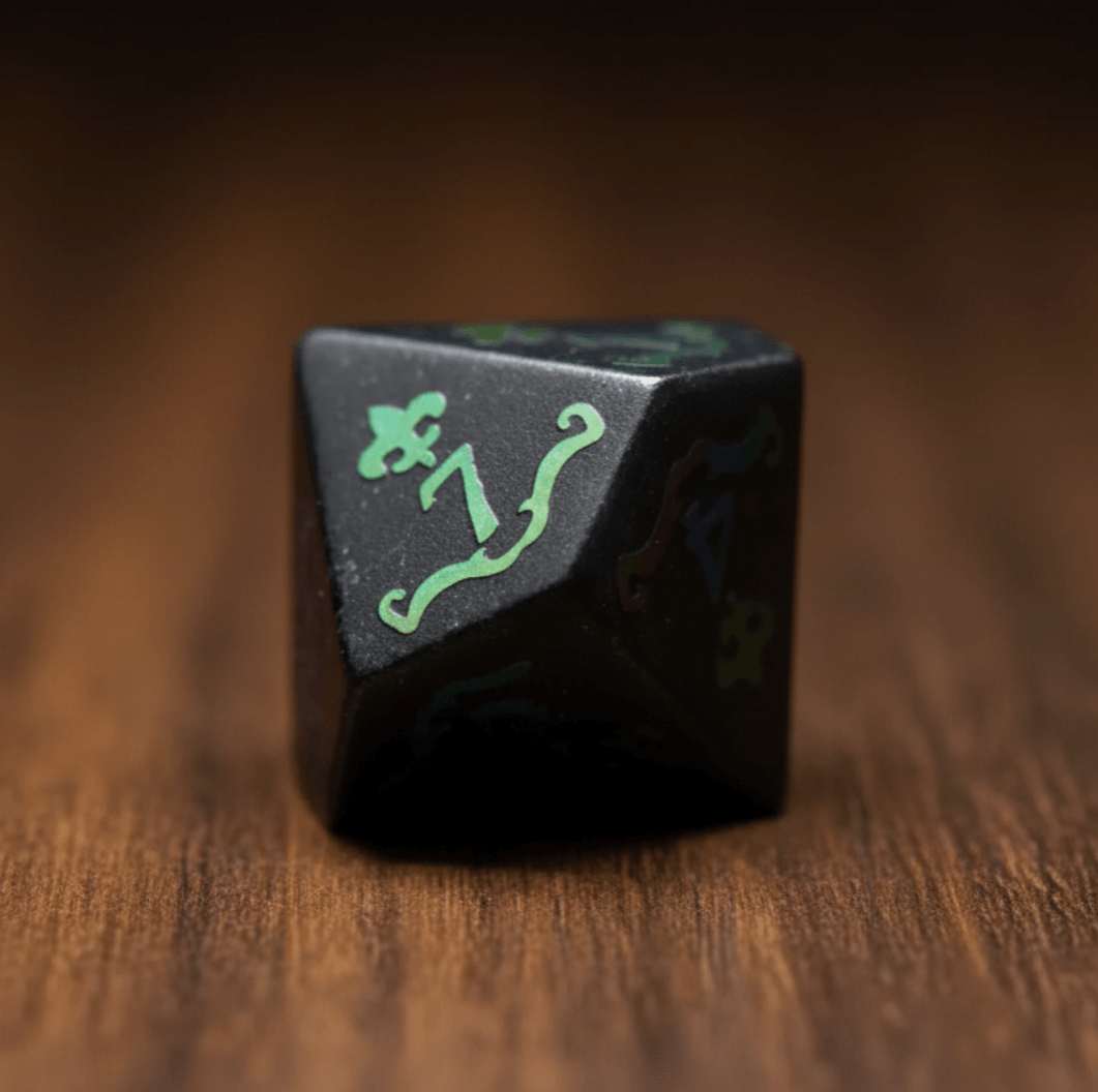 Seven Black Obsidian Crown Gemstone DND Dice Sets are neatly arranged on a dark walnut tabletop.