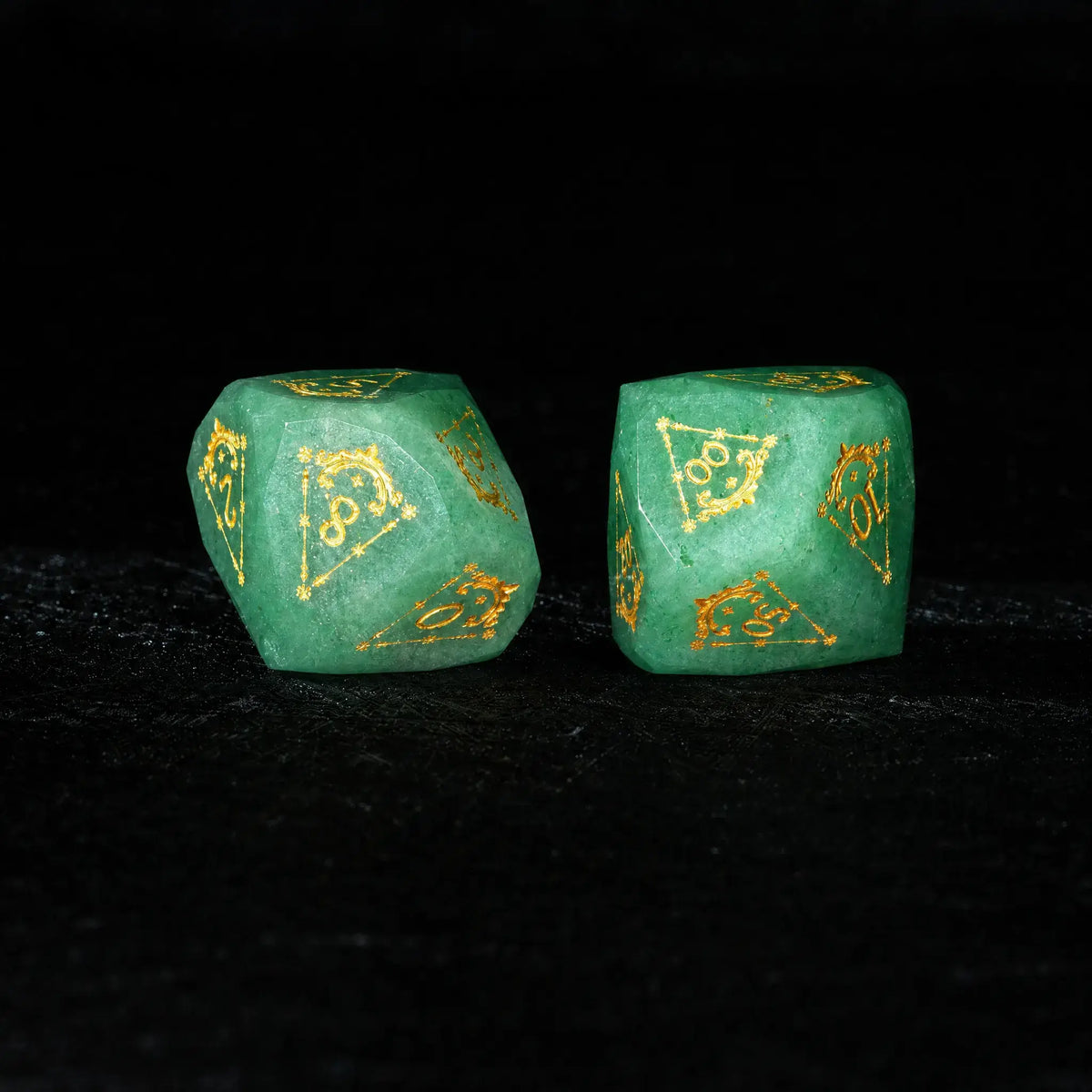 Celestial Green Aventurine Gemstone Dice Set, close-up of two polyhedral dice with gold celestial numbers