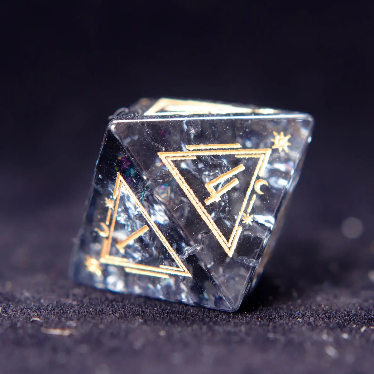 Solo shot of a D6 from the Black Crystal Dice Set, highlighting geometric precision