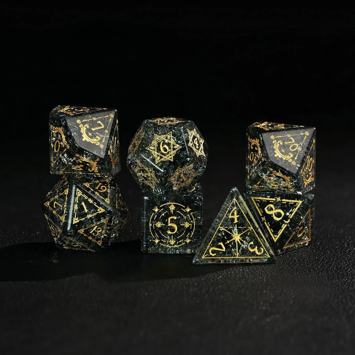 Several of the sharp-edged green glass dice are stacked on top of each other, showcasing their facets, luster, and overall design.