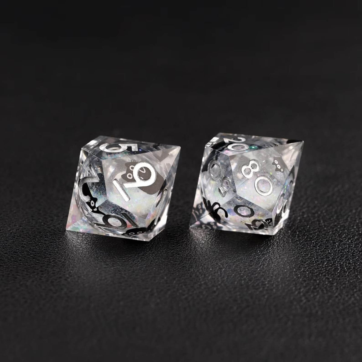 High-contrast photo emphasizing the metallic silver swirl effect of the Liquid Core Dice Resin Set.