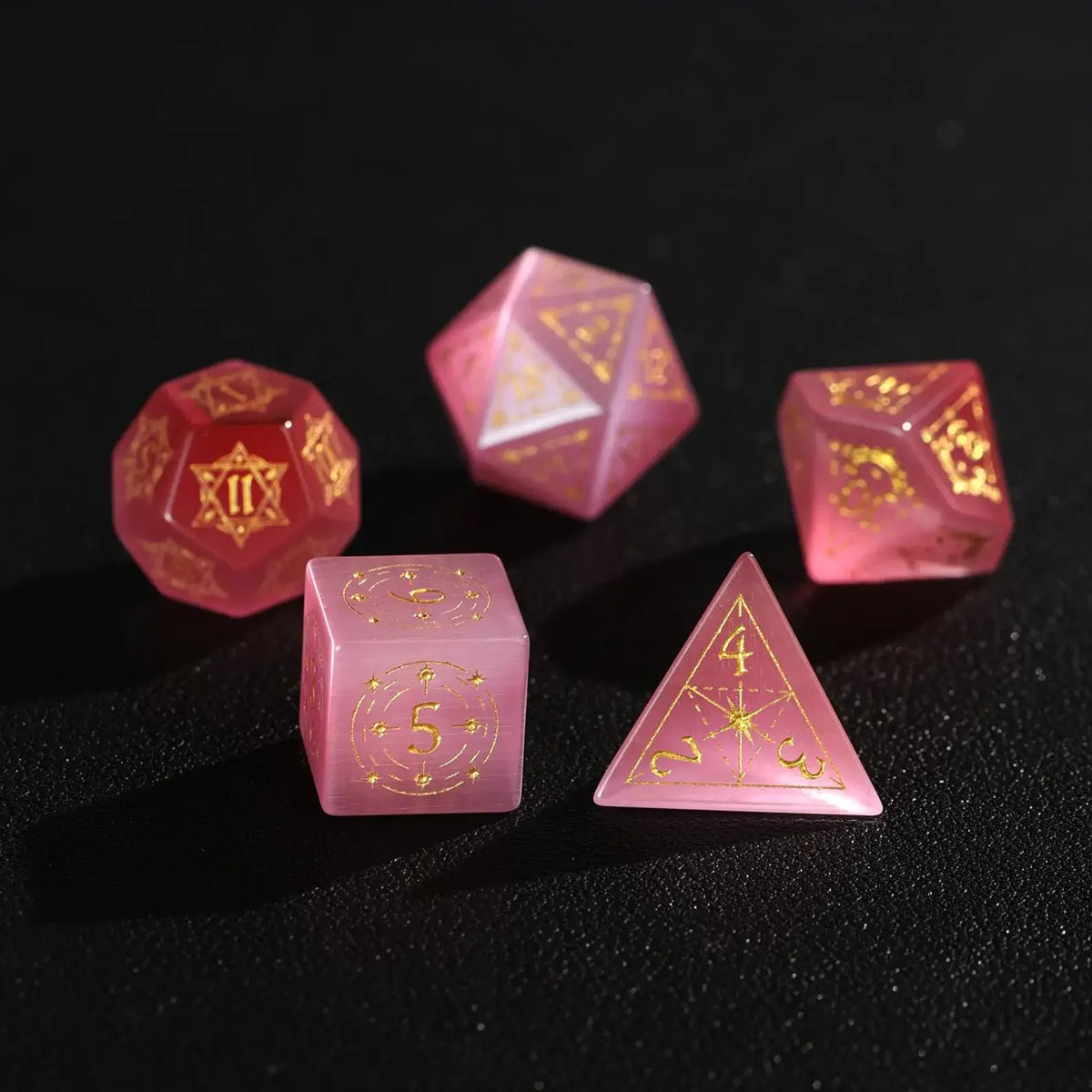 Five pieces of high-quality Pink Cat's Eye Gemstone Dice displayed together, focusing on the luxury feel and precise numerical engraving.