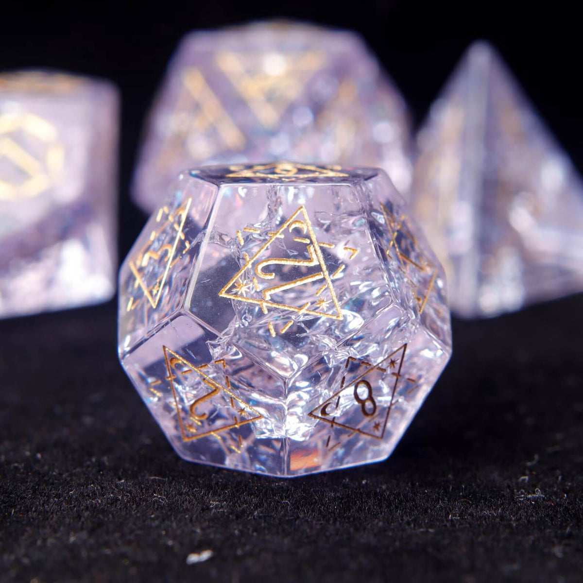 Pink Glass Sharp Edge RPG Dice Set scattered across a pure black background. Shows the luxury finish and light reflection of the dice.