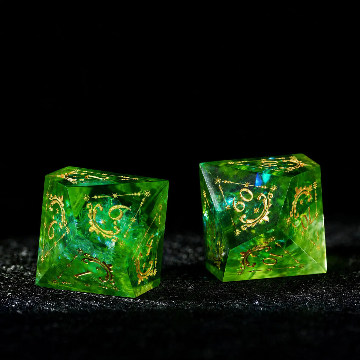 Emerald Cosmic Foil Sharp Edge Resin Dice Set, two dice stacked to show transparent color and gold engraving