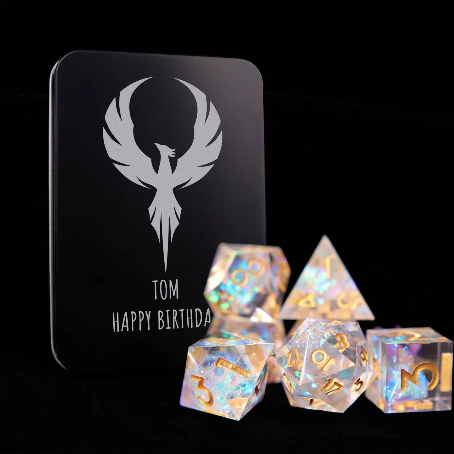 Elegant rainbow transparent resin RPG dice set with gold numbers suitable as a gift for tabletop RPG collectors