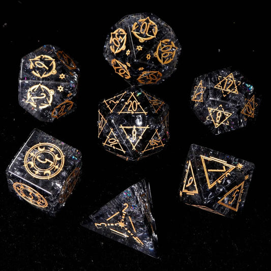 Full presentation of the Black Crystal DND Dice Set, showcasing all seven sharp-edged polyhedral dice with gold inlaid numbers, arranged formally on a luxurious dark slate surface.