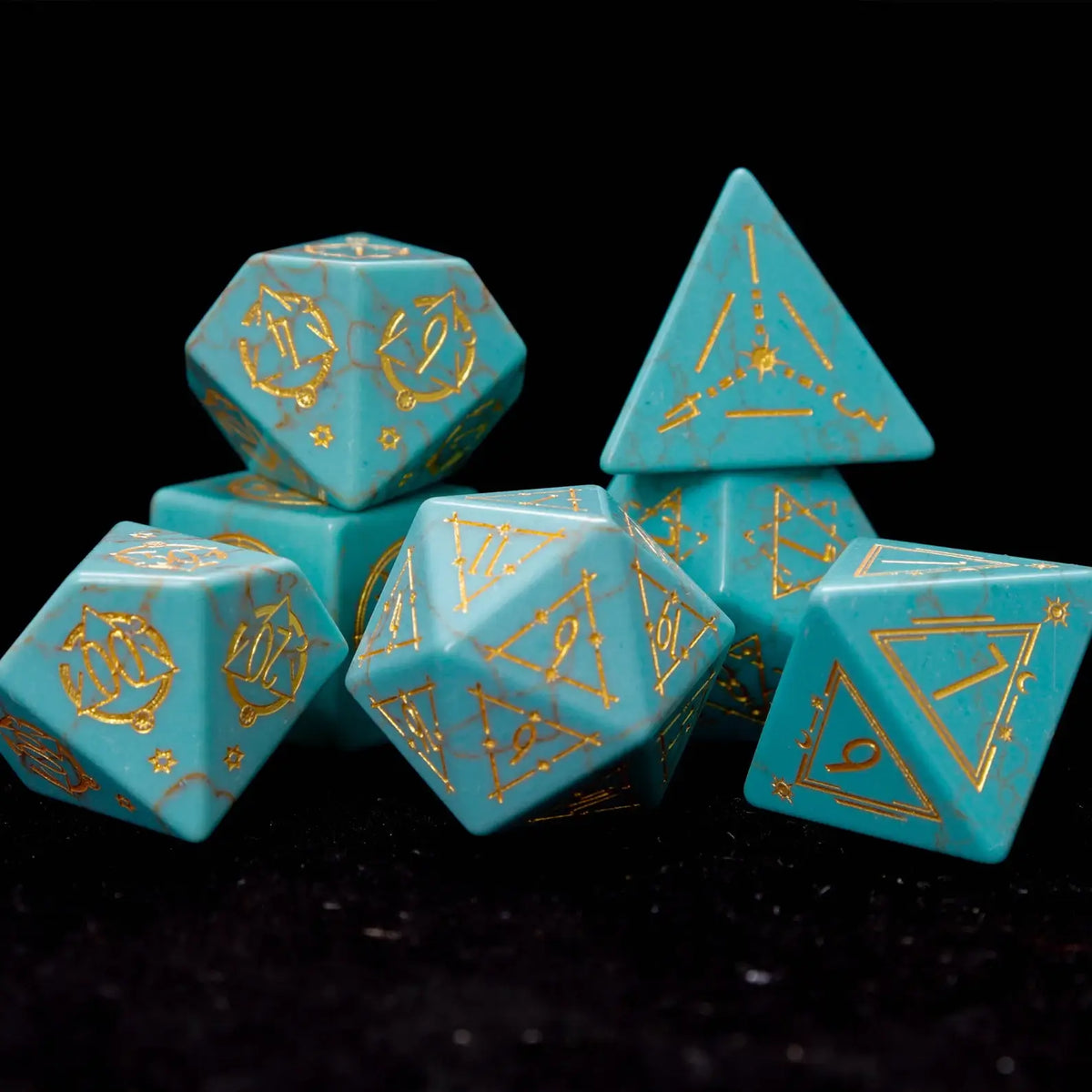 full set of seven engraved green howlite dice elegantly arranged