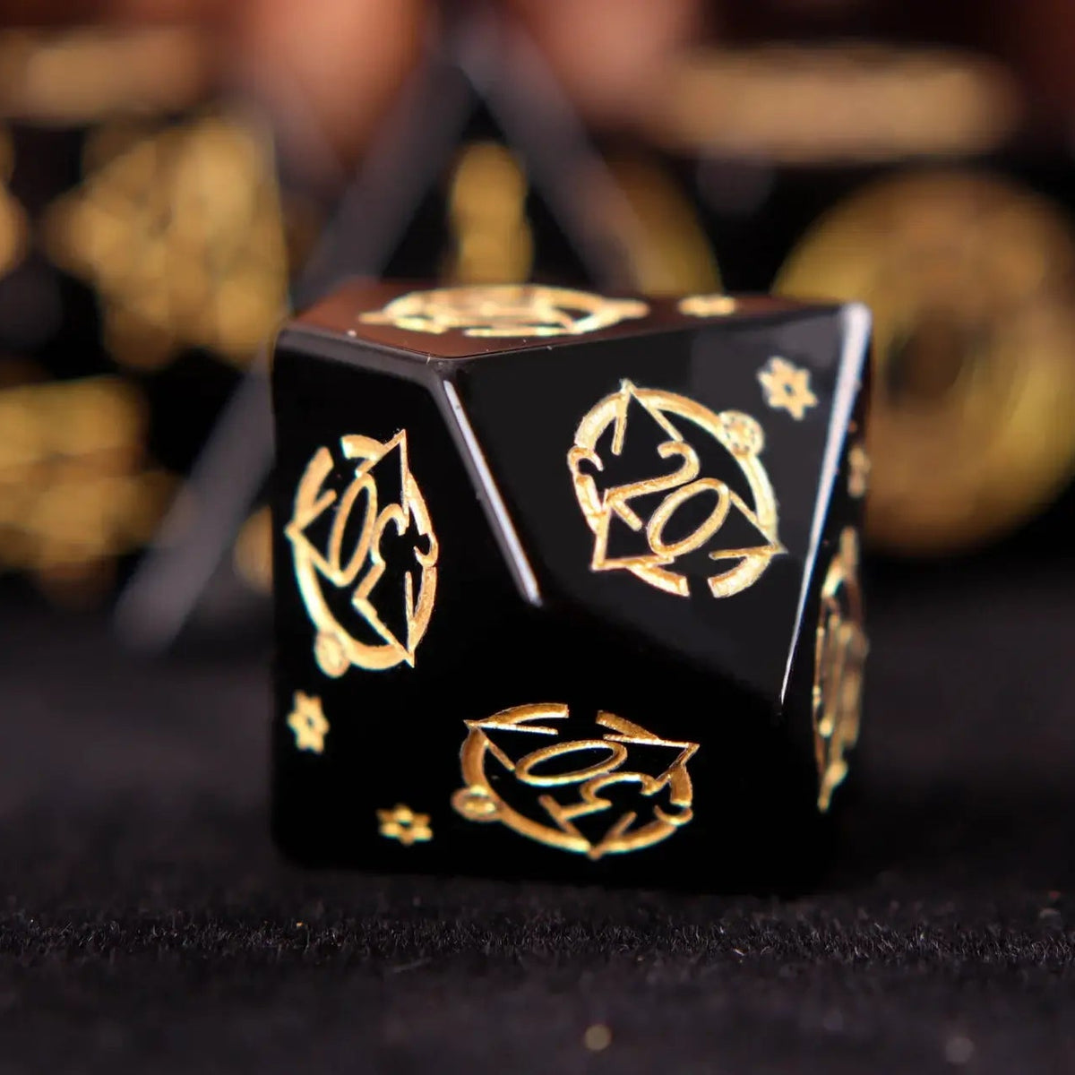 Single hand-carved black Obsidian D10 dice with precise craftsmanship and collector-grade design