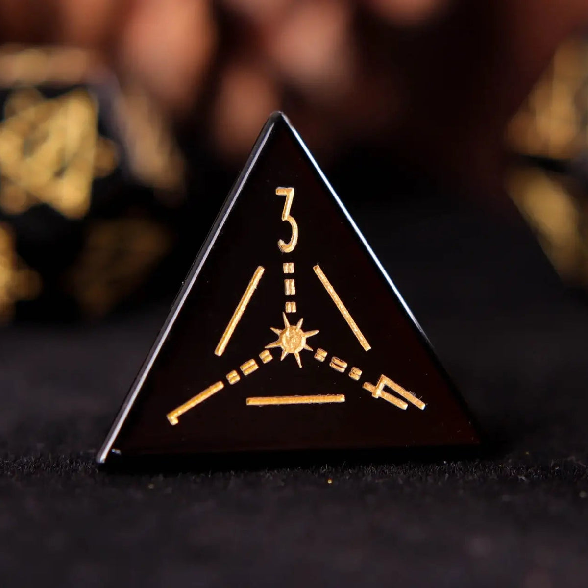 Single hand-carved black Obsidian D4 dice with frosted texture and precise edges, perfect for collectors and players