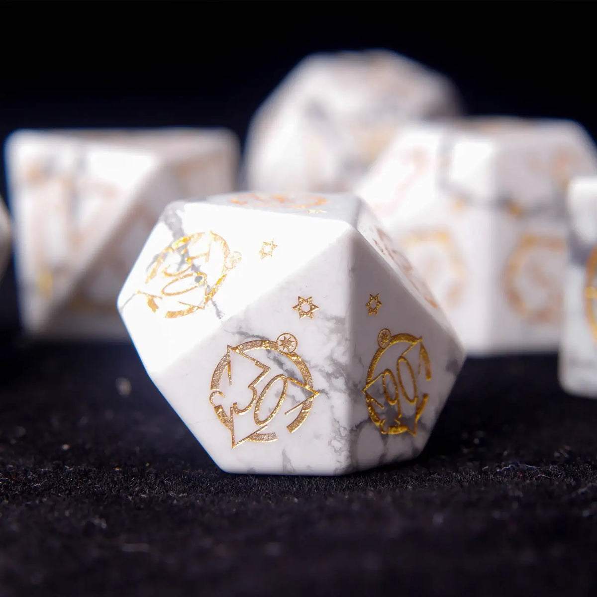 Side profile view of an engraved White Howlite D10 die.