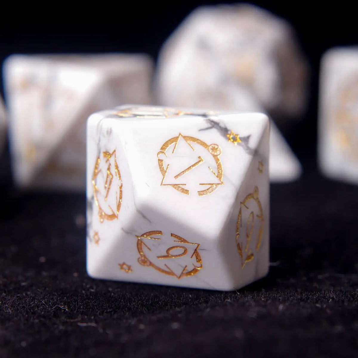 Single White Howlite D8 die showcasing its geometric shape and multi-face engravings.