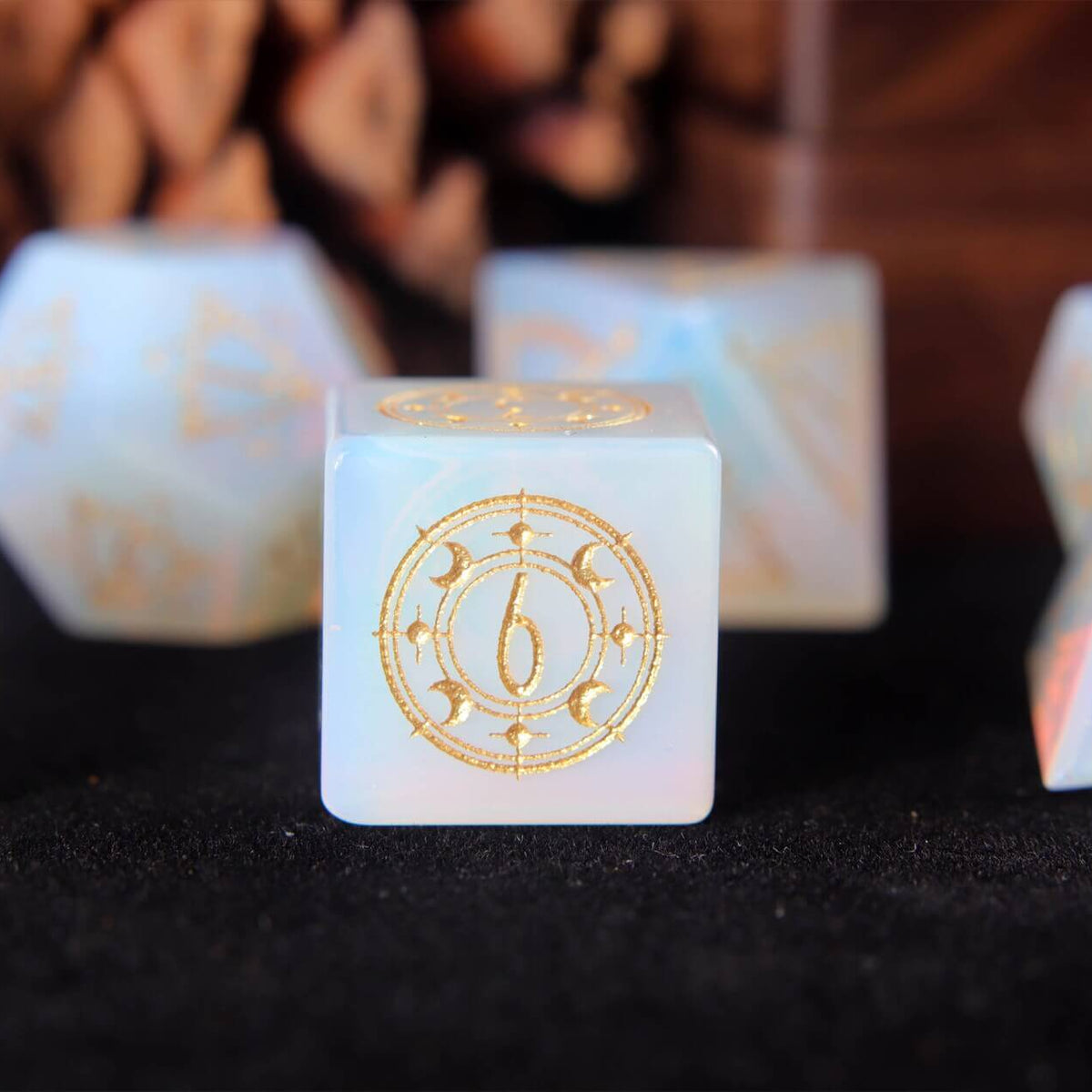 White sculpted opal D8 displaying ice-crystal textures and clean engraved edges.