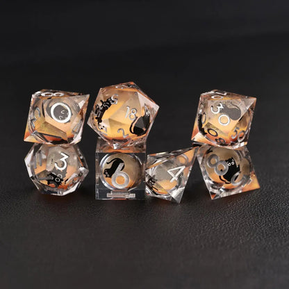 Complete 7-piece Liquid Core Dice Resin Set with Orange Swirl and black cat animal dice insert.
