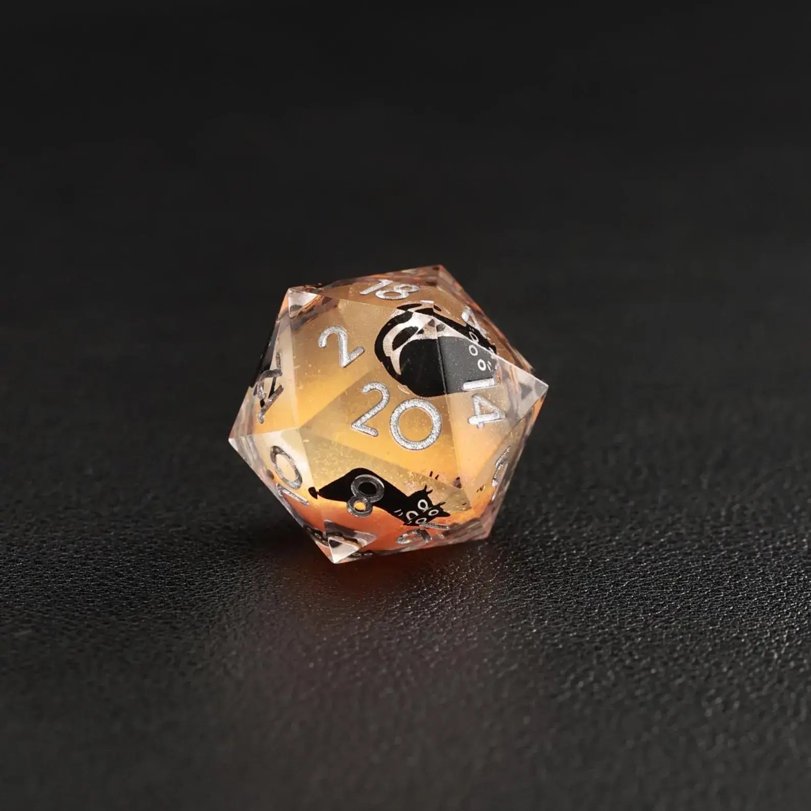 Detailed image of the animal dice d20 with black cat silhouette in the Liquid Core Dice Resin Set.