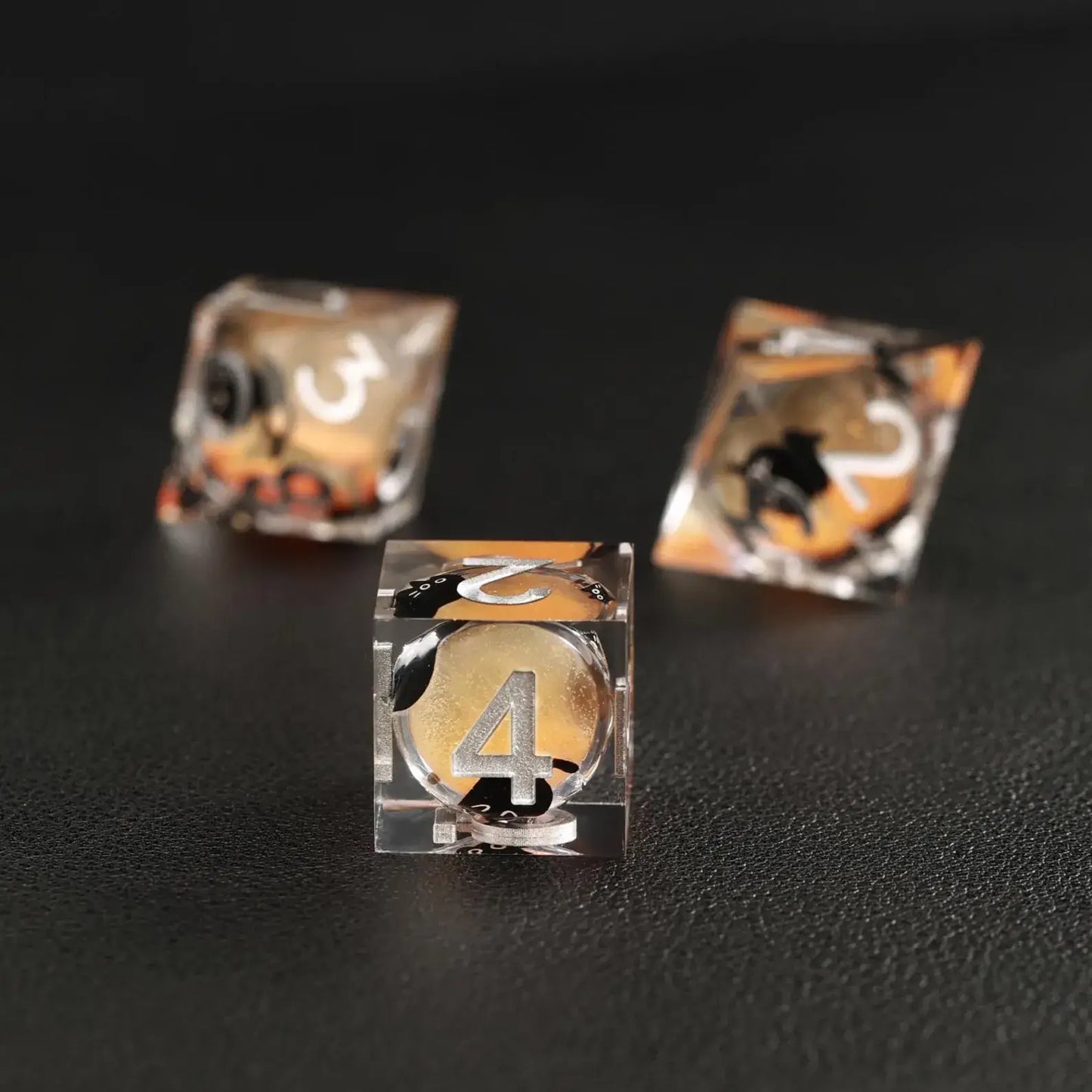 Tabletop RPG game accessories: Orange Swirl Liquid Core Dice Resin Set with the unique black cat animal dice.