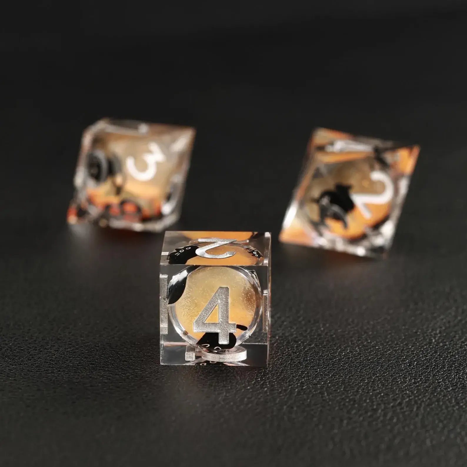 Tabletop RPG game accessories: Orange Swirl Liquid Core Dice Resin Set with the unique black cat animal dice.