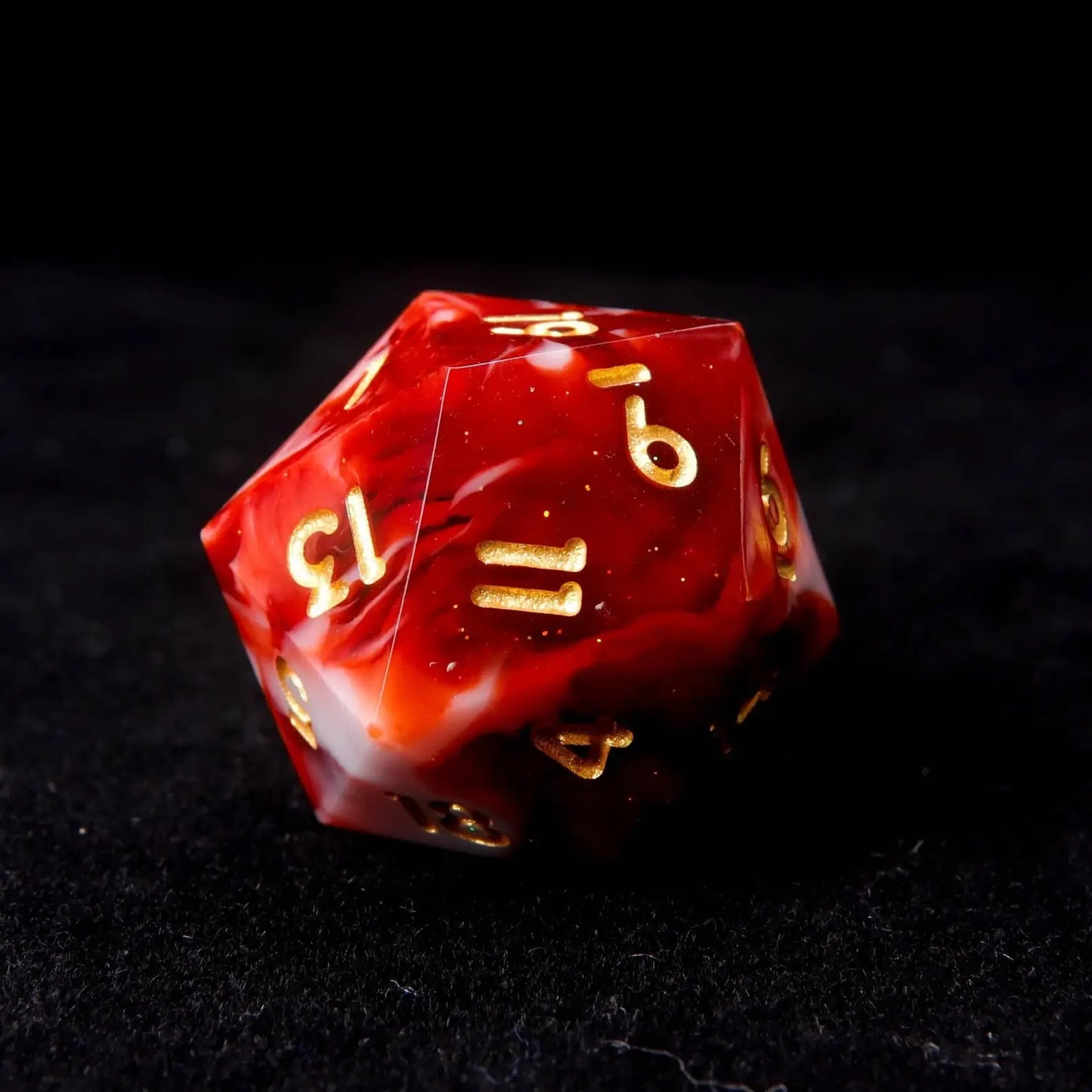 A resin D20 with a mixture of red and white, and fine white shimmer like snow.