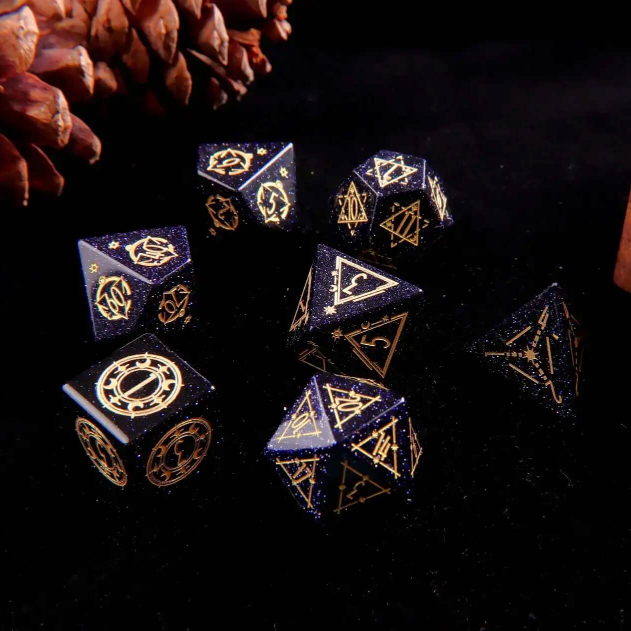 A set of 7 D&D Blue Sandstone Gem-carved Dice on a black background