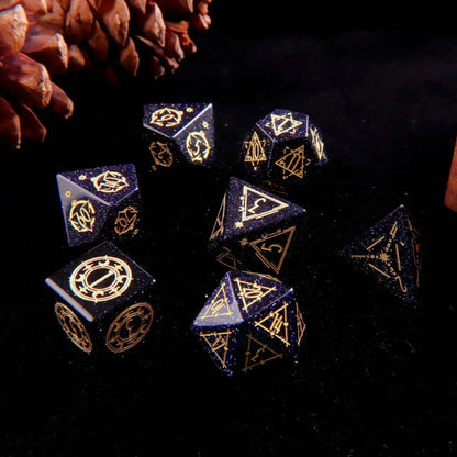 A set of 7 D&D Blue Sandstone Gem-carved Dice on a black background