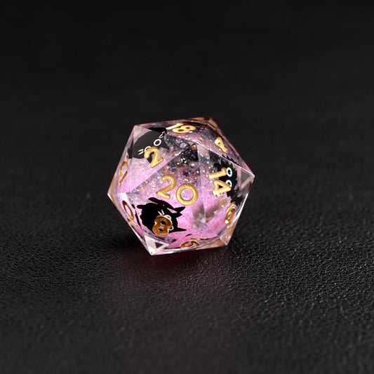 Specific image of the d20 die from the Liquid Core Dice Resin Set, emphasizing the black cat animal dice and pink fluid.