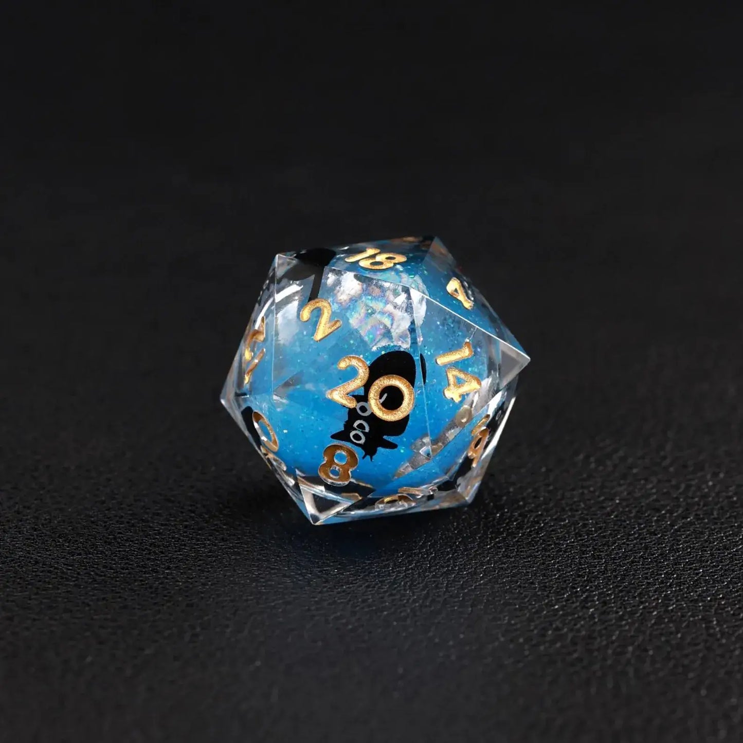 High-contrast shot emphasizing the deep blue swirling effect of the Liquid Core Dice Resin Set.