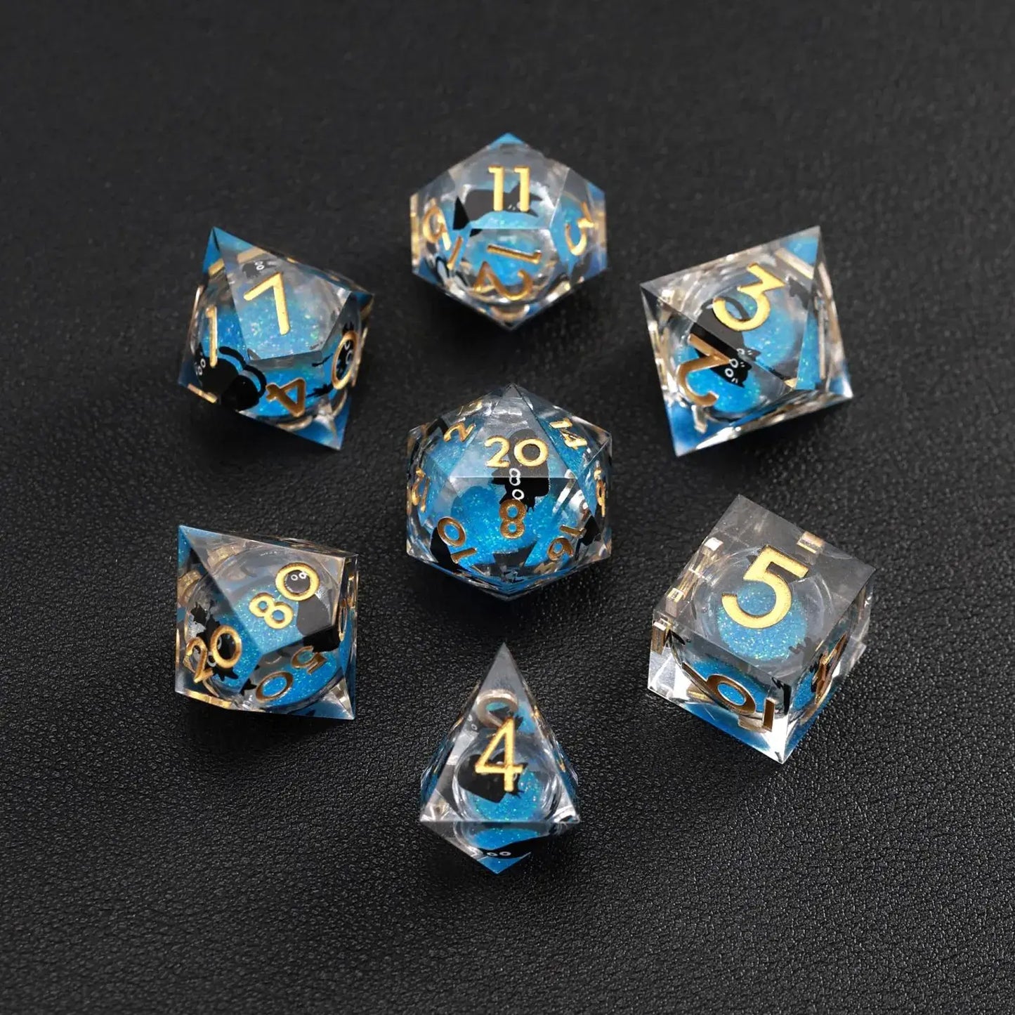 Close-up of Blue Swirl Liquid Core Dice Resin Set featuring the black cat animal dice inclusion.