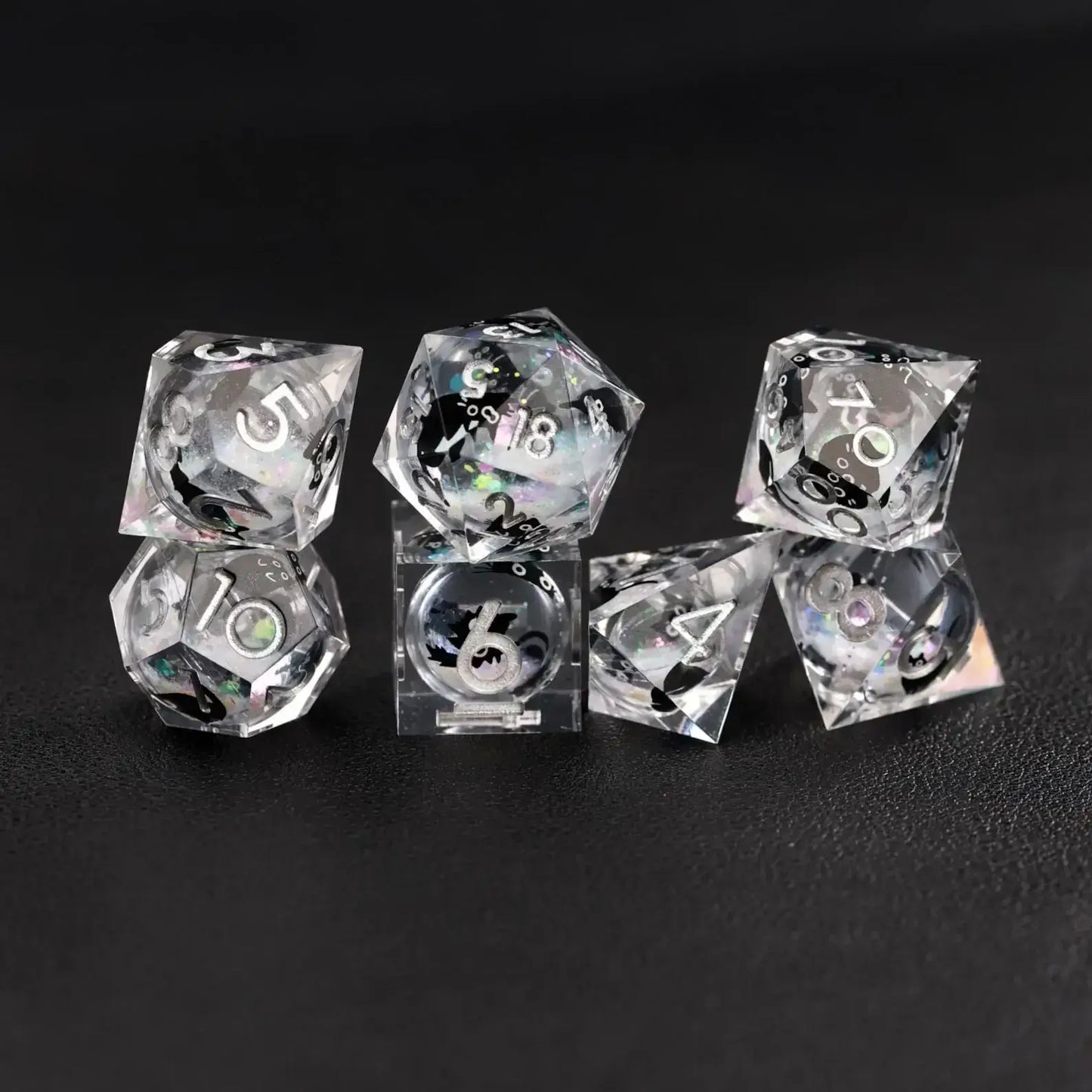 Close-up of Silver Swirl Liquid Core Dice Resin Set, highlighting the black cat animal dice inclusion.