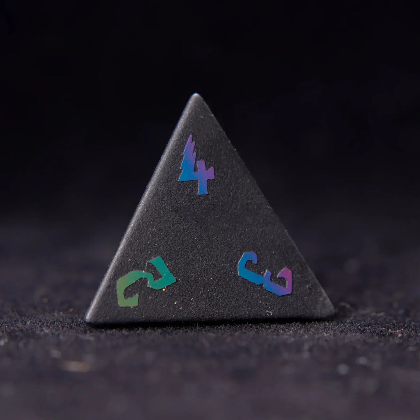 Black Obsidian D4 Lightning die with striking obsidian veins, offering a precise roll and adding a touch of elegance to your dice collection