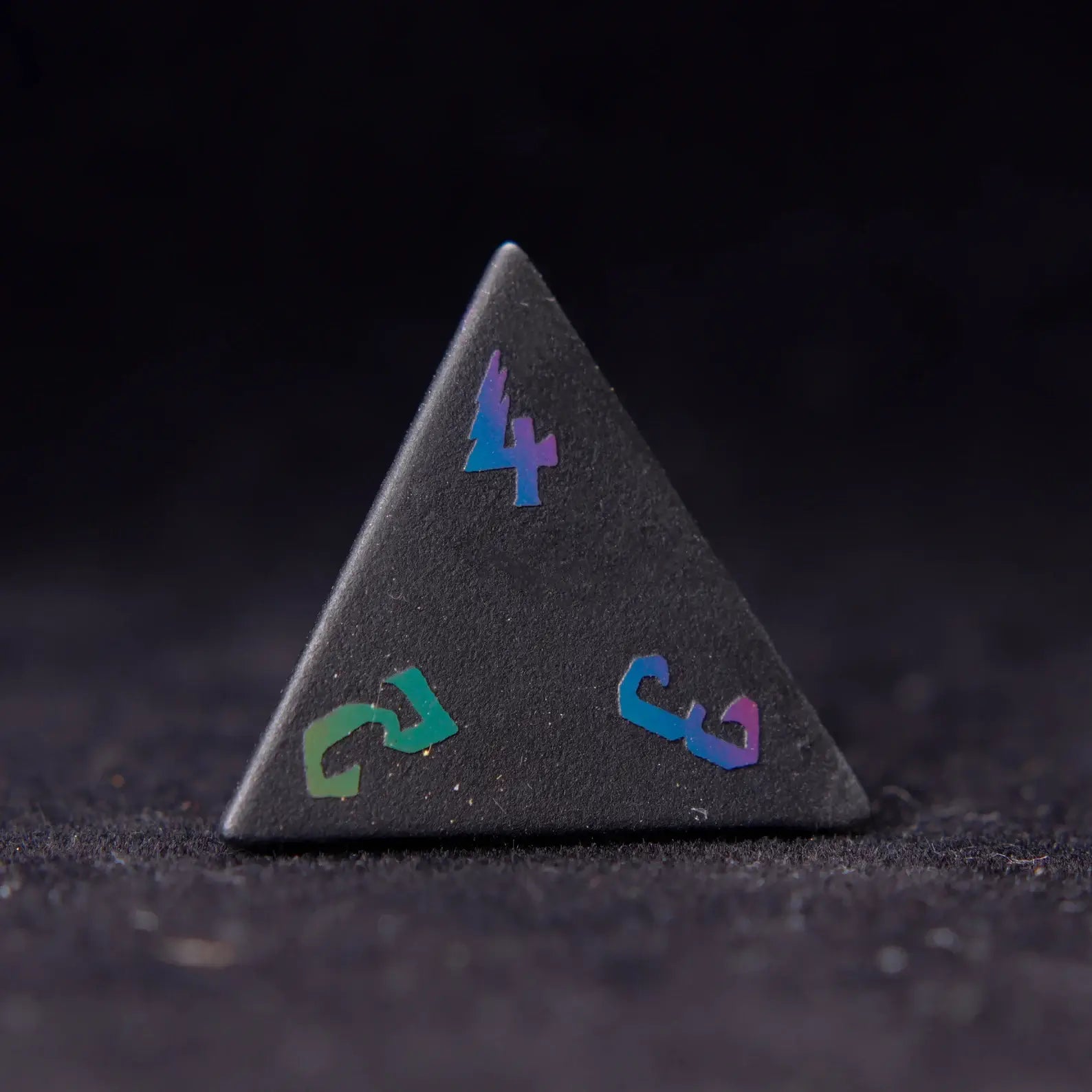 Black Obsidian D4 Lightning die with striking obsidian veins, offering a precise roll and adding a touch of elegance to your dice collection
