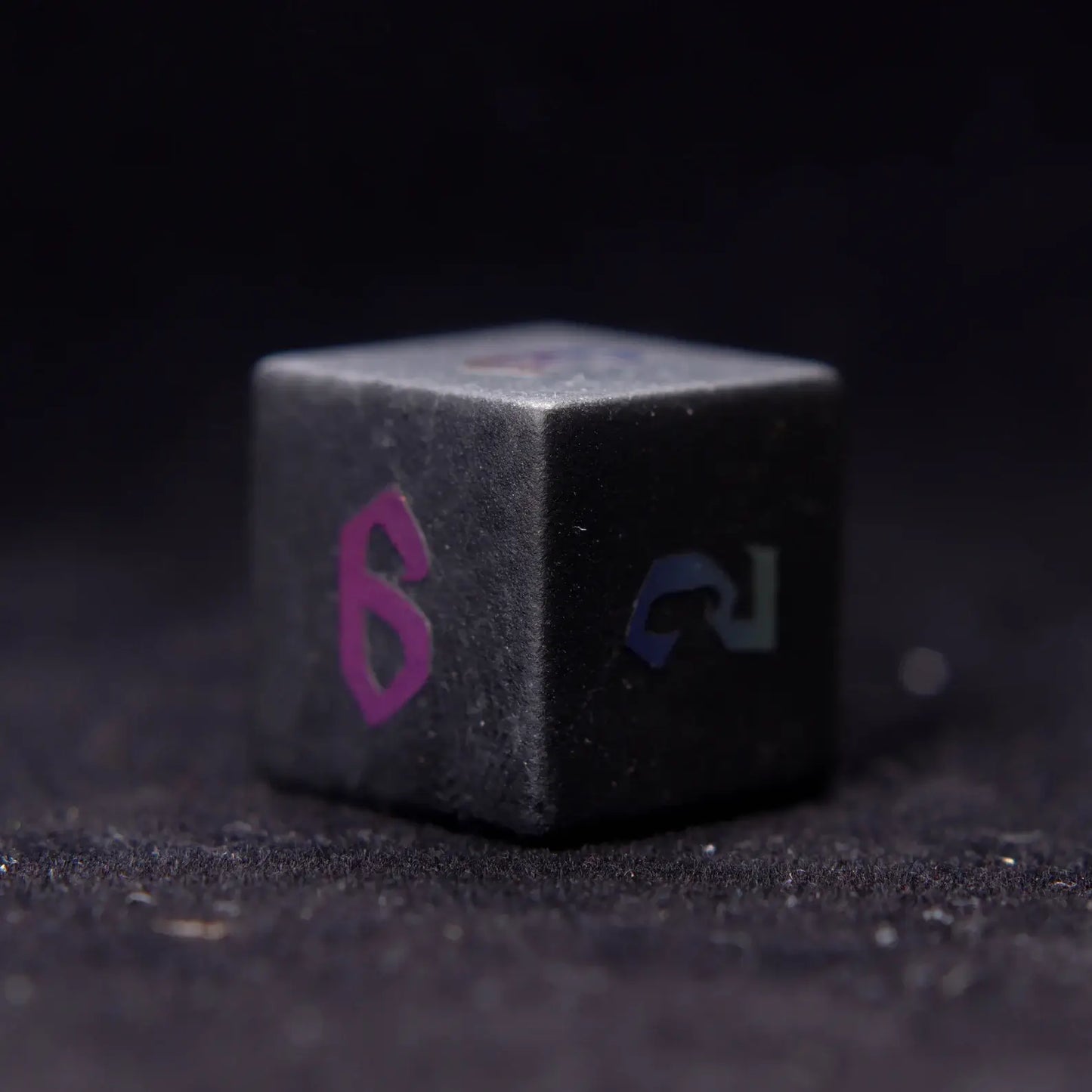 A sharp and polished Black Obsidian D6 Lightning die, designed for perfect weight and smooth rolls in every game.