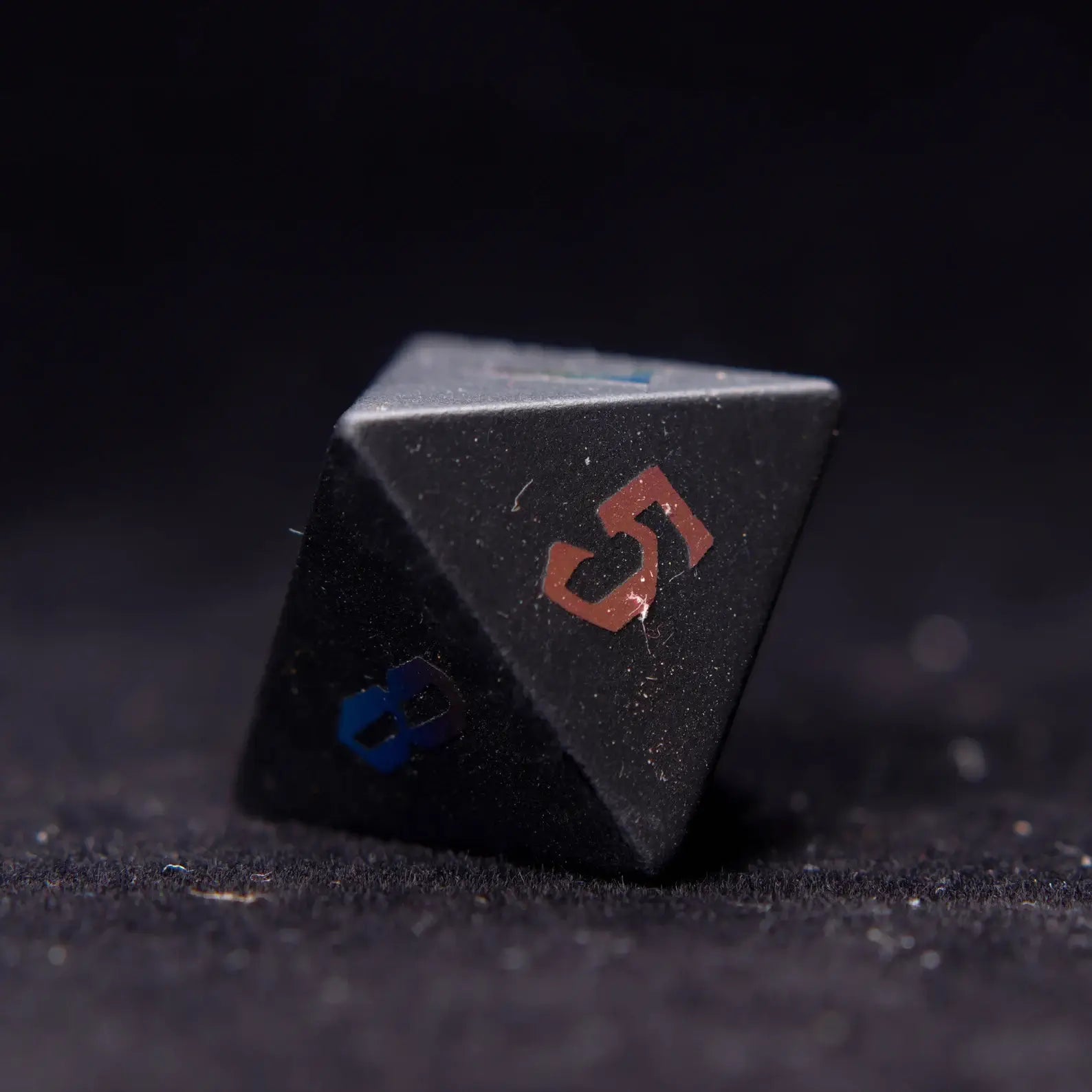 A beautiful Black Obsidian D%0 Lightning die, showcasing smooth surfaces and dynamic lightning details, ideal for role-playing games.