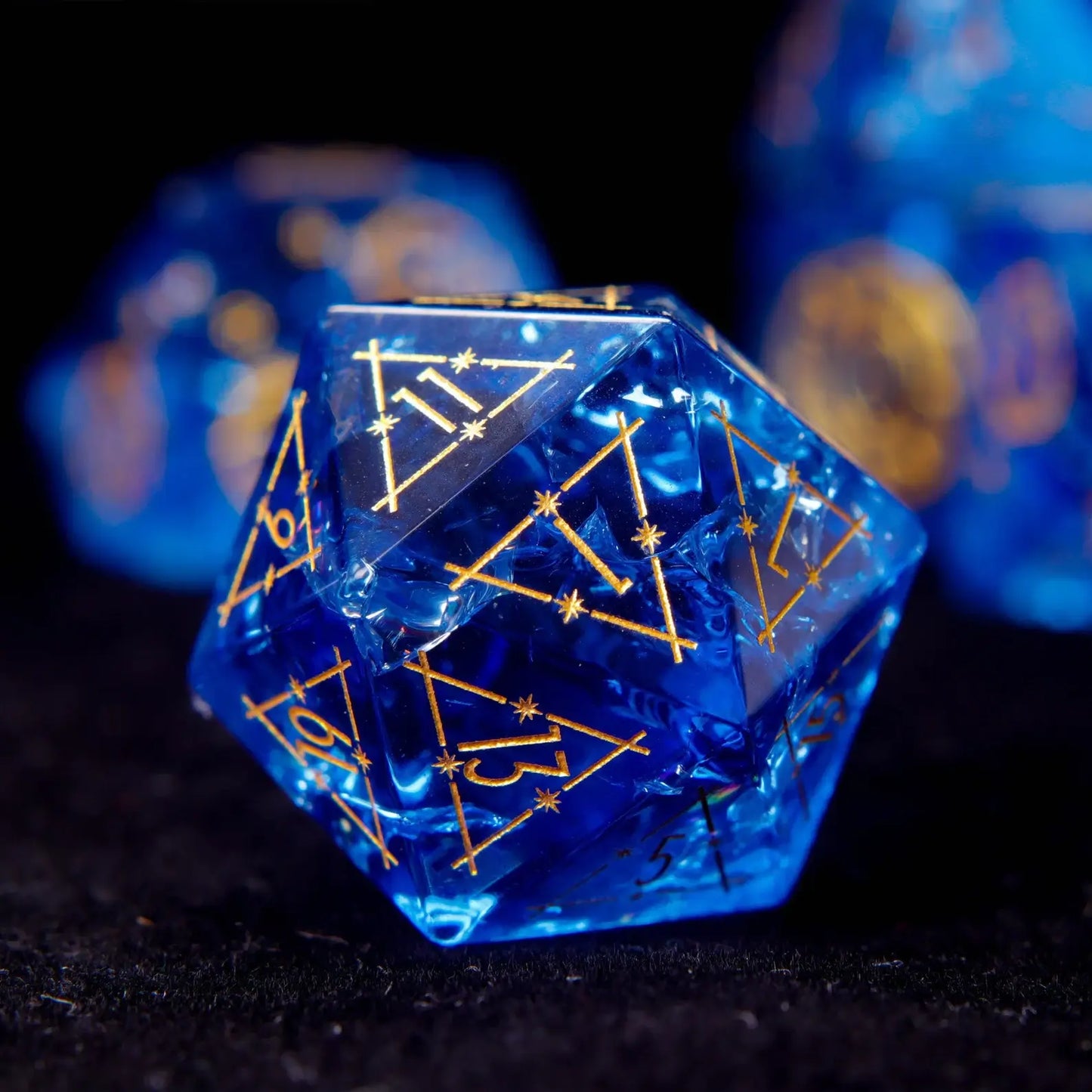 Blue glass sharp edge D20 with gold constellation pattern and gold numbers