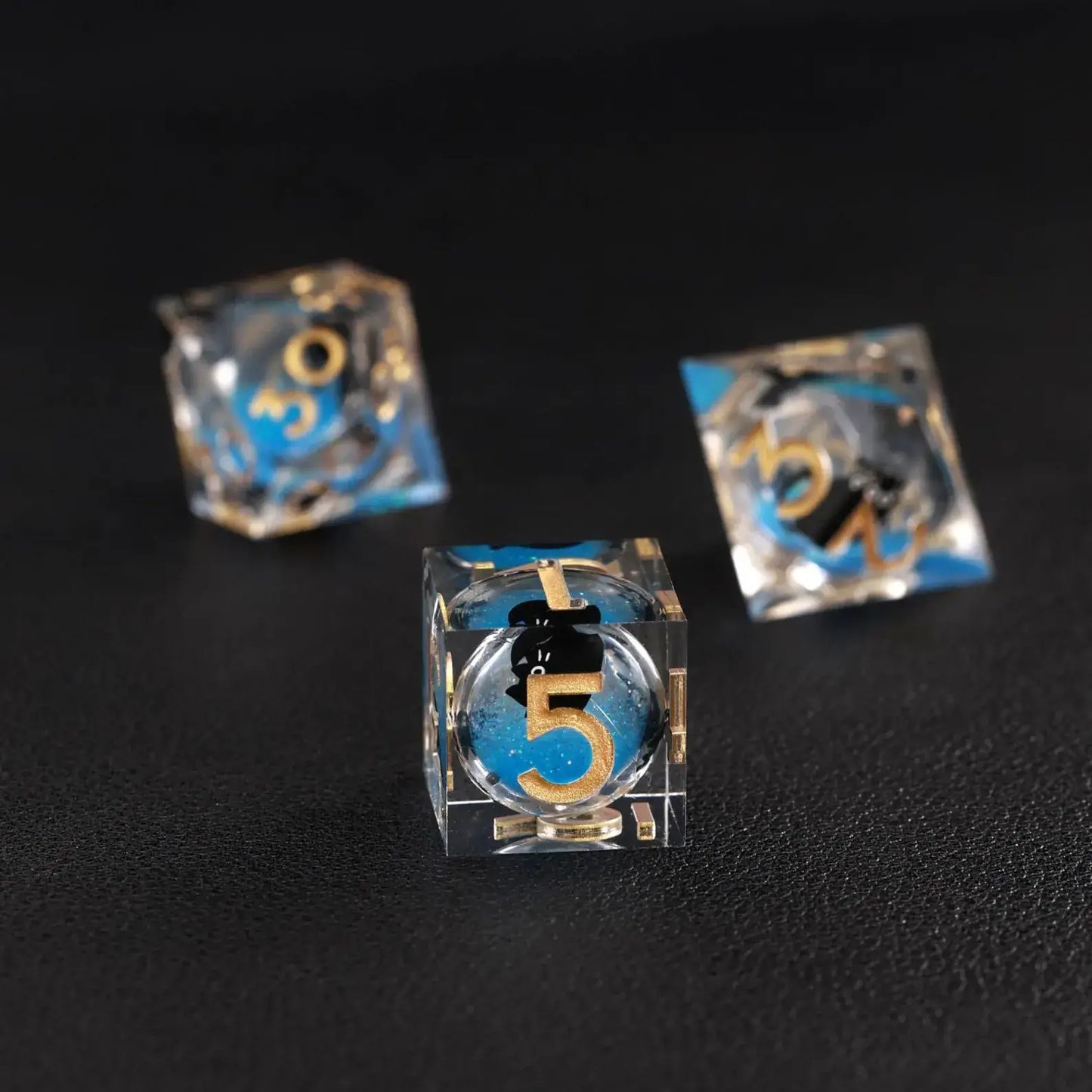 High-contrast shot emphasizing the deep blue swirling effect of the Liquid Core Dice Resin Set.