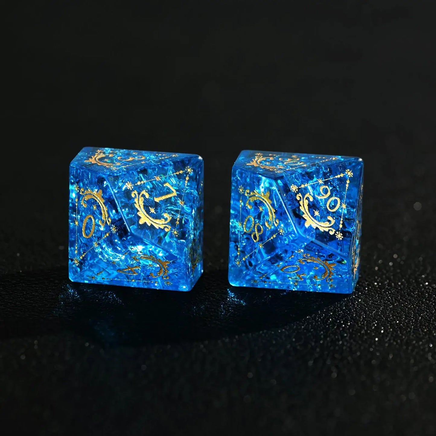 Blue Glass Sharp Edge RPG Dice Set scattered across a pure black background. Shows the luxury finish and light reflection.