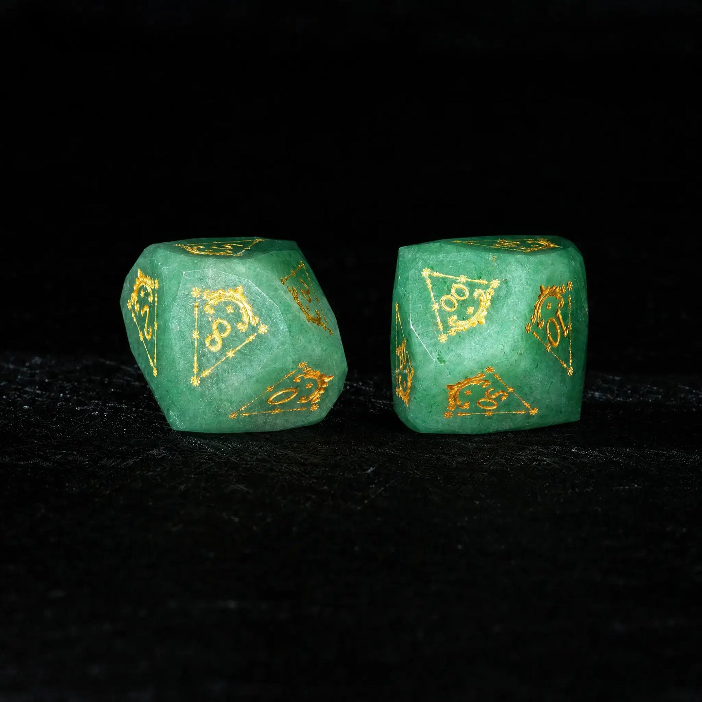 Celestial Green Aventurine Gemstone Dice Set, close-up of two polyhedral dice with gold celestial numbers