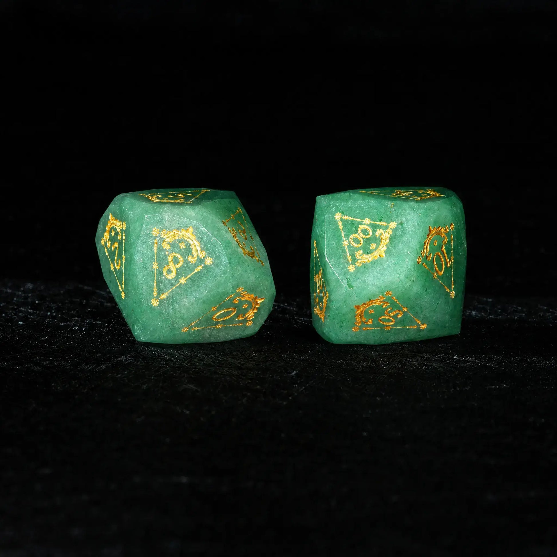 Celestial Green Aventurine Gemstone Dice Set, close-up of two polyhedral dice with gold celestial numbers
