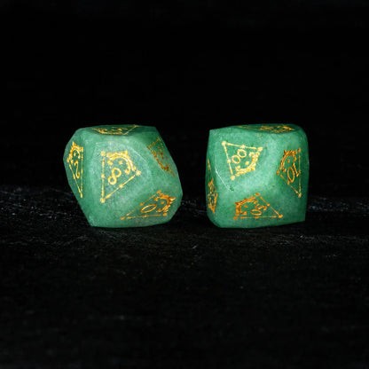 Celestial Green Aventurine Gemstone Dice Set, close-up of two polyhedral dice with gold celestial numbers