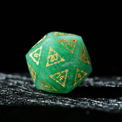 Celestial Green Aventurine Gemstone Dice Set, single d20 on a dark tabletop background