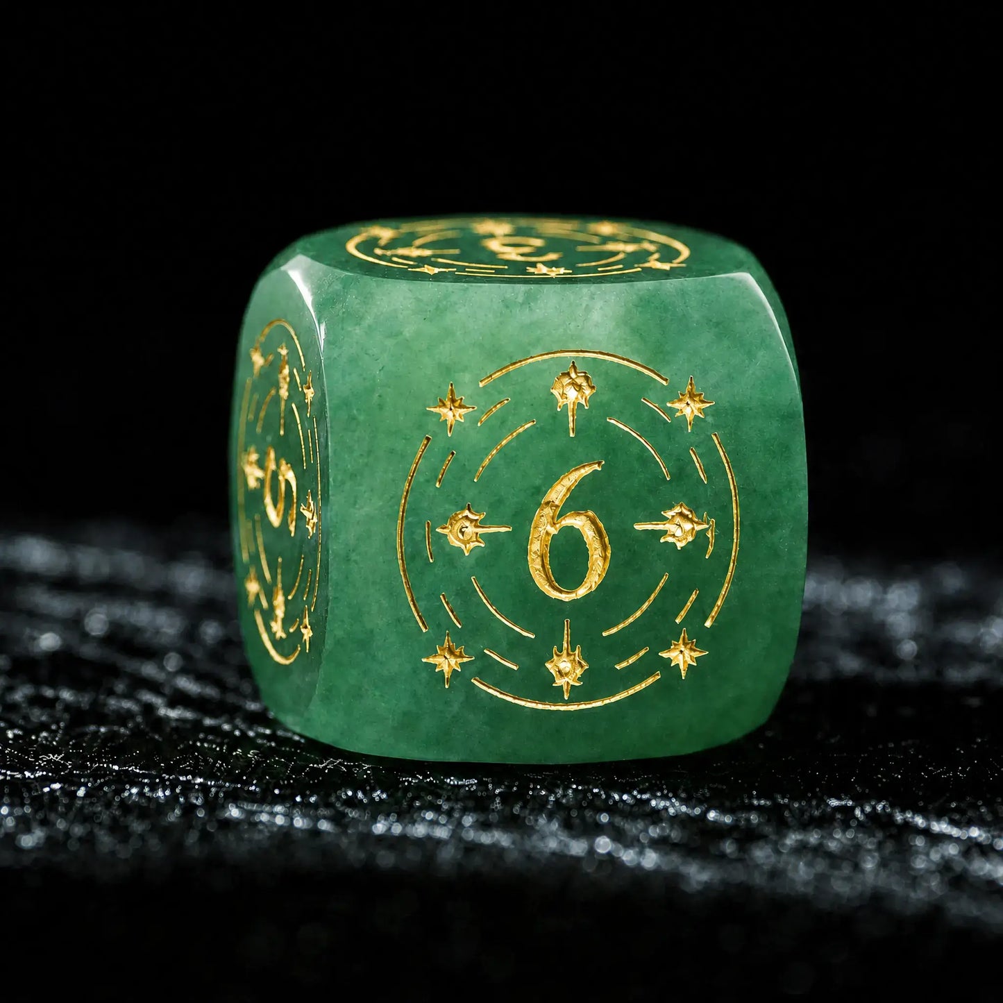 Celestial Green Aventurine Gemstone Dice Set, close-up of a d6 showing ornate gold celestial engraving