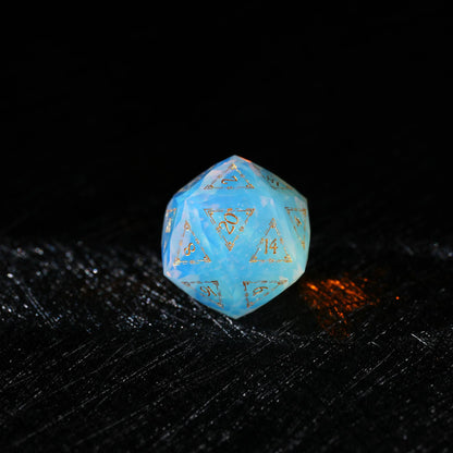 Sky Blue Opalite Glass Dice Set, single d20 on a dark tabletop background