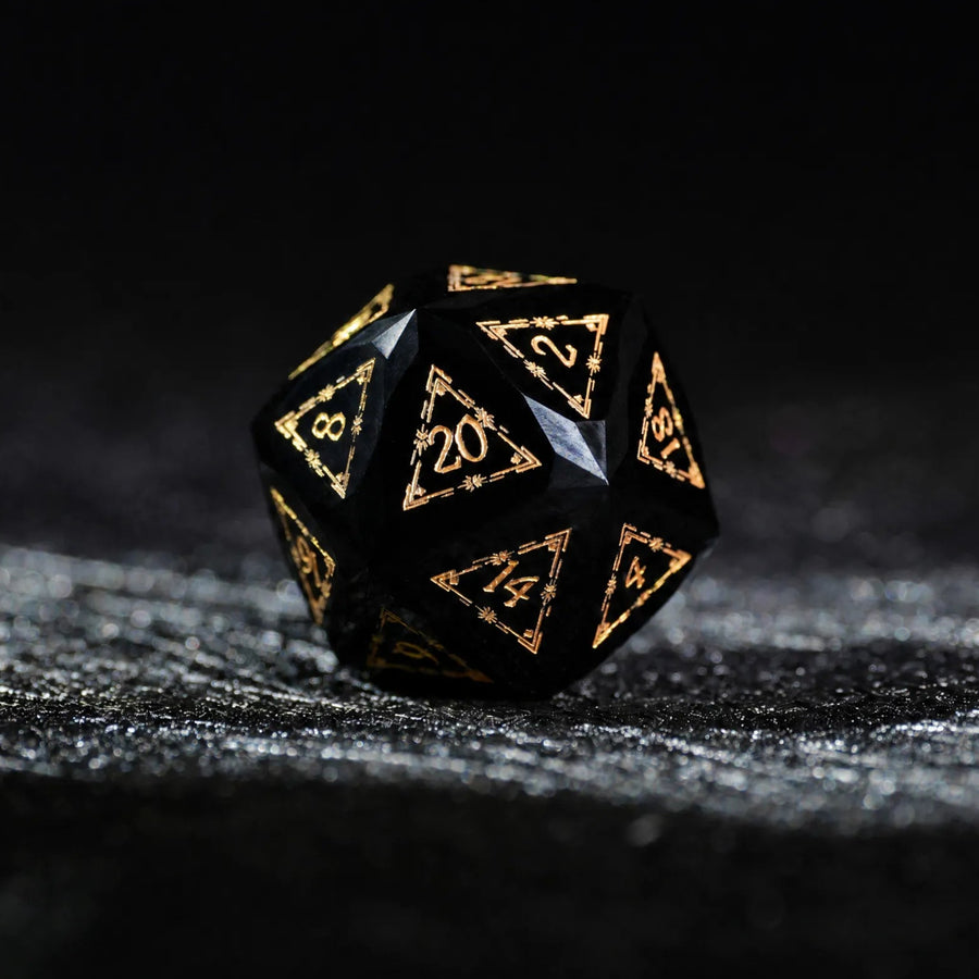 Celestial Black Obsidian Dice Set, single d20 on a dark tabletop background