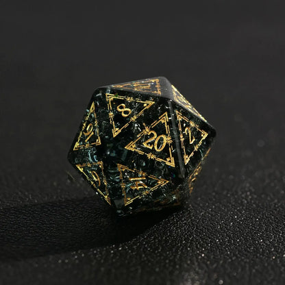 Extreme close-up of a sharp-edged, emerald-green, glass-like D20 die with the silver number 20 facing up, highlighting the transparent material.