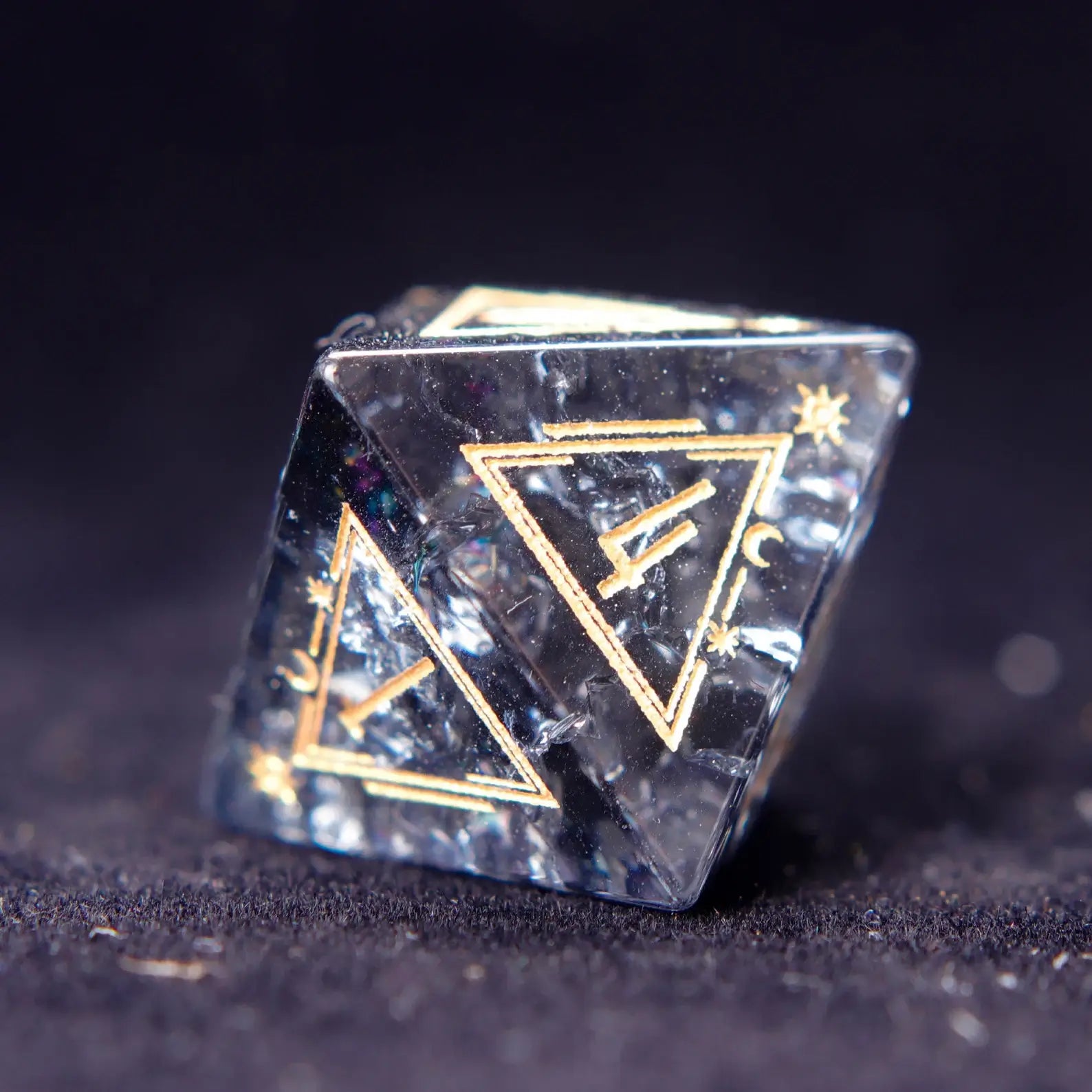 Solo shot of a D6 from the Black Crystal Dice Set, highlighting geometric precision