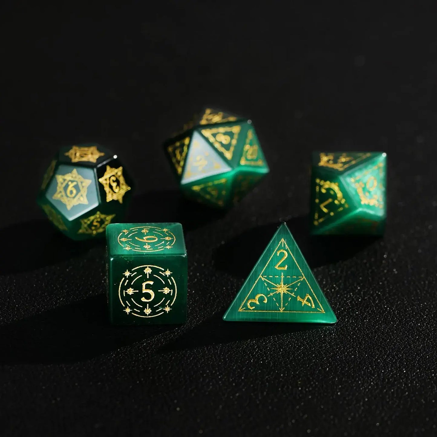 Five pieces of high-quality Dare Green Cat's Eye Gemstone Dice with Gold Inking displayed together, focusing on the luxury feel and precise numerical engraving.