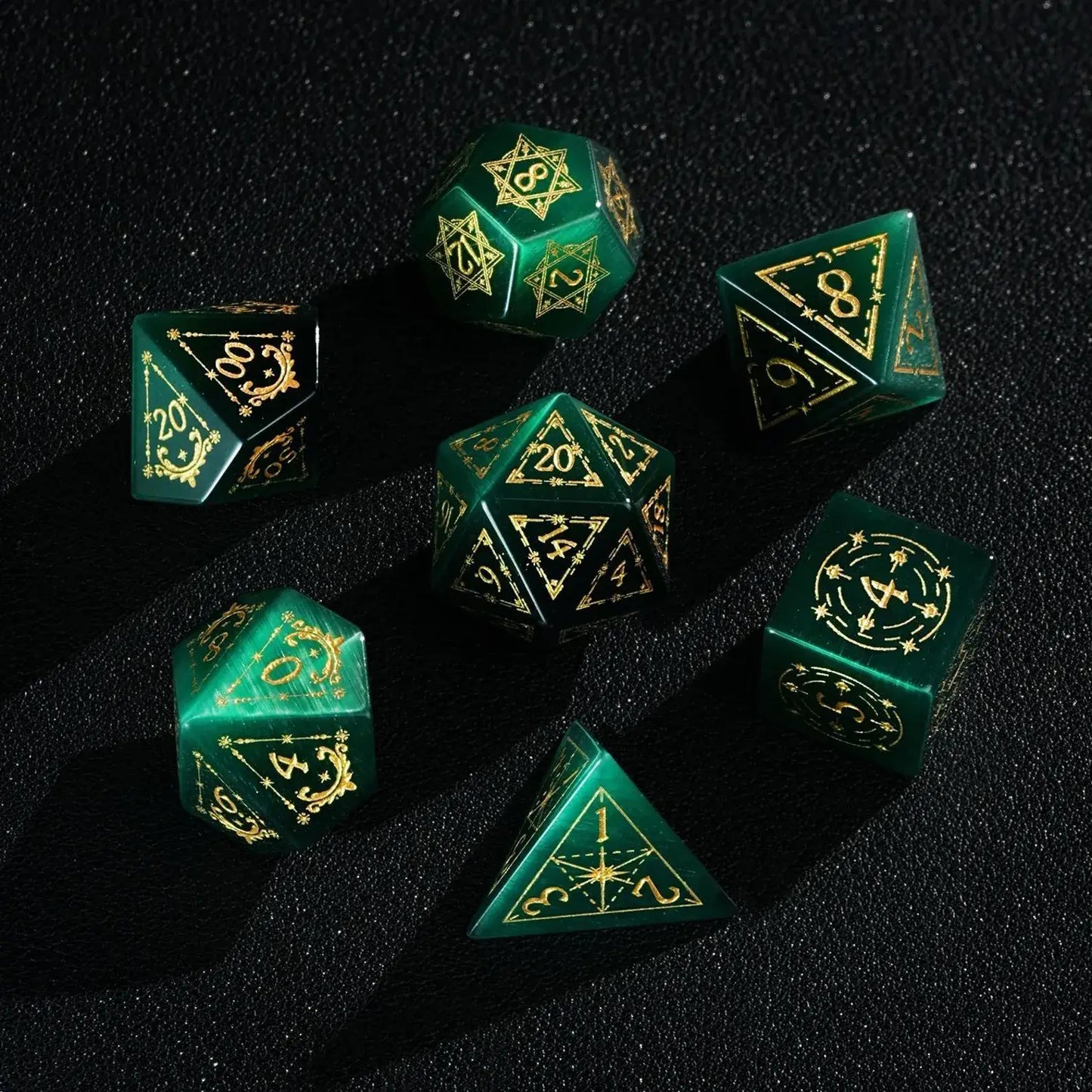 A hand gently holding a Dare Green Cat's Eye D20 die with Gold Inking, providing scale and highlighting the dice's substantial feel and handcrafted DND quality.