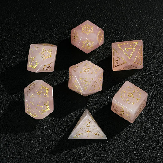  Full D&D Pink Crystal Engraved Dice Set on black background, showing all seven polyhedral dice with sharp edges and translucent pink glow