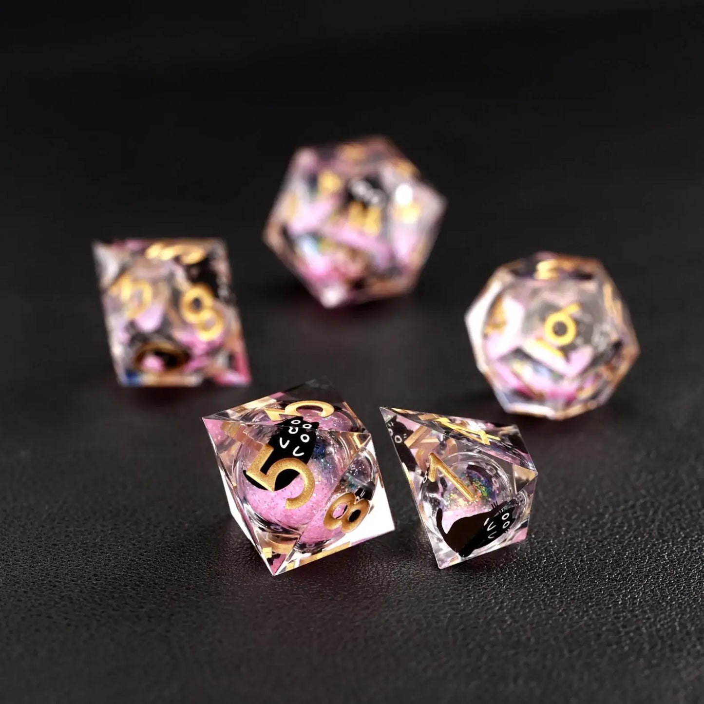Assortment of polyhedral shapes in the Liquid Core Dice Resin Set with the animal dice feature.